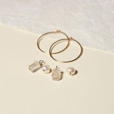 Why settle for just one style when you can have multiple? Our 5 Way Charm Hoop Set offers 5 unique ways to wear them, allowing you to change up your earring game every day: Simple Hoops, Pearl-adorned Hoops, Quartz-decorated Hoops, Mix and Match Hoops, and the best of both worlds with Charmed Hoops. The versatile combination of clear quartz and fresh water pearls make these earrings the perfect match for any outfit. These hoops are perfect for anyone who loves a hoop that's just the right size! Best Of Both Worlds, Fresh Water Pearls, Water Pearls, 5 Ways, Mix And Match, Clear Quartz, Perfect Match, Fresh Water, Freshwater Pearls