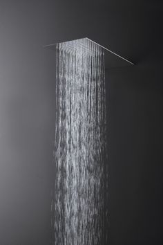 a shower head with water flowing from it