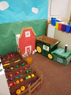 a room filled with lots of toys and boxes on the floor next to each other