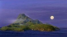 an island in the middle of the ocean under a full moon