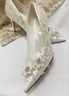 Simply Beautiful Hand Finished Daisy Chain Embellished Satin Bridal Shoes Satin Bridal Shoes Beautifully Hand Finished with Silver Diamante Flowers with Pearl Very Elegant Perfect Wedding Day Shoe High for Elegance Perfect for Comfort Sizes: UK 3-7 (EU 36-41) Beautifully Presented with Tissue Wrap Beautiful Wedding Shoes Brides Heels, Wedding Shoes Floral, Wedding Footwear For Bride, Embellished Pointed Toe Wedding Shoes, Elegant Wedding Shoes Heels, Diy Wedding Heels, Wedding Heels For Bride, Posh Shoes, Silver Bridal Shoes