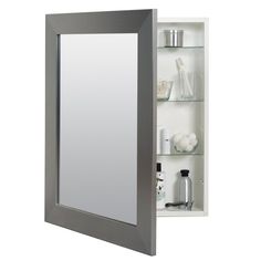 a bathroom medicine cabinet with a mirror above it