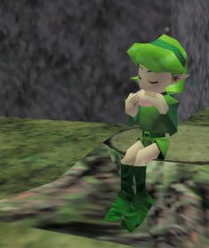 an animated image of a woman dressed in green and sitting on a rock with her hands to her face