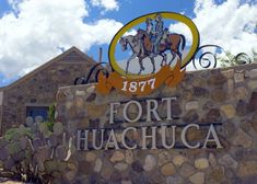 a sign for fort huachuaca with a horse and rider on it