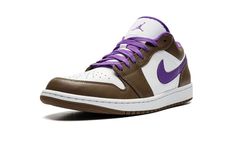 The Air Jordan 1 Low “Purple/Mocha” is a colorway of the low-top retro basketball shoe with a unique appearance.  Keeping things clean and versatile, the shoe is equipped with a white leather base that gives way to contrasting Palomino (brown) leather overlays.  A purple leather Swoosh is found on either side of the shoe.  Purple “Wings” branding is embroidered on the heel.  Underfoot, a white rubber midsole and brown rubber outsole complete the look.  Release date: March 1, 2023 Air Jordan 1 Low Purple, Jordan 1 Low Purple, Logo Wings, 70s Converse, Nike Jordan 1 Low, Nike X Travis Scott, Retro Basketball Shoes, Low Air Jordan 1, Jordan Logo