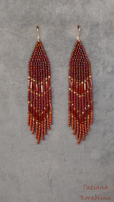 These handmade unique earrings are made of high-quality Czech beads and strong synthetic thread. They are elegant, fashionable, and highly versatile, suitable for everyday wear. Color: brown,bronze,gold. 100% hand made with love! Measurements: Length-about  11cm (4.33 inch) Width -about  2 cm (0,8 inch) Materials: Sterling silver hook Czech glass beads Nylon Thread Brown Copper Beaded Earrings, Brown Dangling Bead Earrings, Brown Dangle Chandelier Earrings With Beads, Handmade Brown Dangle Chandelier Earrings, Brown Earrings With Colorful Beads For Gift, Elegant Beaded Earrings With Colorful Beads, Elegant Brown Beaded Earrings With Colorful Beads, Brown Beaded Dangle Earrings, Brown Dangle Beaded Earrings