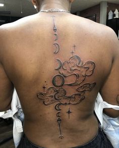 the back of a woman's upper body with clouds and stars on her left side