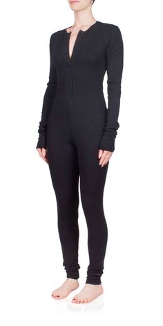 Stay warm and cozy this season in the ETERNE Thermal Long John. Crafted from a lightweight cotton and modal blend, this cozy season must-have item is designed for a close fit with its henley inspired neckline and ultra soft waffle knit fabric. Enjoy a comfortable winter wearing this stylish onesie. Details: Color: Black 48% cotton, 48% modal, 4% spandex Waffle knit fabric Button front closure Vendor Code: CBBR408-04 Fits true to size, intended for a close fit Model is 5ft 5in and is wearing a size S Fall Ribbed Henley For Loungewear, Fall Waffle Knit Henley For Loungewear, Ribbed Long Sleeve Henley For Winter, Winter Ribbed Long Sleeve Henley, Winter Long Sleeve Ribbed Henley, Fitted Long Sleeve Ribbed Henley, Relaxed Fit Henley For Fall Loungewear, Fitted Long Sleeve Henley For Fall, Solid Color Long Sleeve Henley For Winter