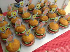 there are many cupcakes that have been decorated with cartoon characters and decorations on them