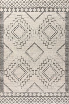 a gray and white rug with diamond shapes