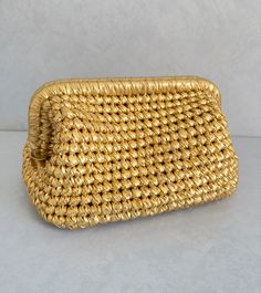 Introducing our stunning Gold Metallic Crochet Cloud Bag--a mesmerizing evening accessory that effortlessly combines elegance with contemporary charm. Handcrafted to perfection, this clutch features a captivating crochet design interwoven with lustrous gold metallic threads. Radiating sophistication, this shiny bag elevates your ensemble with its ethereal cloud-like silhouette, making it the perfect choice for glamorous occasions. Whether it's a gala or an intimate soirée, this versatile evening Gold Shoulder Bag With Braided Handles For Formal Occasions, Formal Gold Shoulder Bag With Braided Handles, Luxury Straw Clutch Bag For Everyday Use, Luxury Straw Clutch For Everyday Use, Luxury Woven Straw Evening Bag, Luxury Crochet Bag With Braided Handles For Evening, Evening Straw Clutch Bag With Braided Handles, Luxury Woven Clutch, Luxury Crochet Pouch Bag For Evening