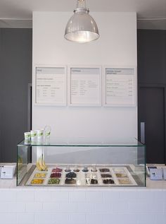 a display case in a restaurant filled with lots of food