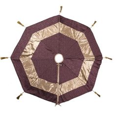 an upside down umbrella with tassels on the bottom and gold foil covering it