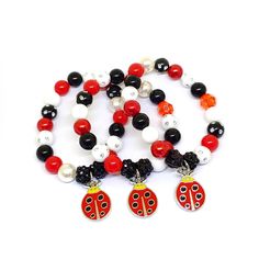 These adorable stretchy bracelets are the perfect favor for your little one's ladybug themed party! Each bracelet features an enameled ladybug charm, resin rhinestone beads and an assortment of red, black and white 10mm acrylic beads strung with durable stretch cord. Each bracelet will arrive individually packaged in an organza bag. Please select the amount of bracelets and the size needed from the drop down menus. Not quite what you are looking for? Request a custom order! To be the first to kn Ladybird Birthday, Miraculous Ladybug Party, Ladybug Party, Clay Bracelet, Stretchy Bracelets, Rhinestone Bead, Bead Stringing, Acrylic Beads, Themed Party