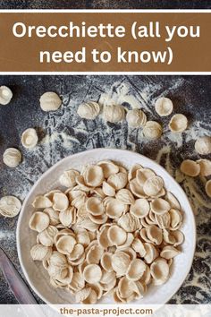 a white bowl filled with cashews on top of a table