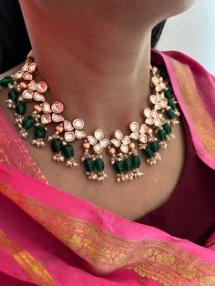 A perfect piece for your next wedding occasion! Adorn yourself with this gorgeous Kundan Jewellery piece. Handcrafted by our skilled Indian craftsmen from Jaipur Length of earrings: 6 cms Materials: Brass Copper mix, kundan stones, green beads, gold plated It can be worn both as a necklace and a choker. The necklace and earrings are the same as shown in the pictures. We have only one piece in this color and design, hence you get what you see in the pictures. Fusion Tilla Necklaces For Wedding, Green Fusion Kundan Necklace For Weddings, Green Fusion Bridal Necklace For Reception, Fusion Style Cutdana Necklaces For Weddings, Fusion Style Cutdana Necklace For Wedding, Fusion Cutdana Necklace For Weddings, Fusion Style Cutdana Wedding Necklace, Green Fusion Necklace For Reception, Fusion Style Green Bridal Necklace For Celebrations