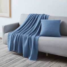 Angled View of Arcylic Throw Set in Blue on Sofa#color_acrylic-blue Bed Sheet Painting Design, Chunky Knit Throw Blanket, Blue Throw Blanket, Colorful Throw Pillows, Chunky Blanket, Blue Throws, Blue Throw Pillows, Blanket Throw, Fine Linens