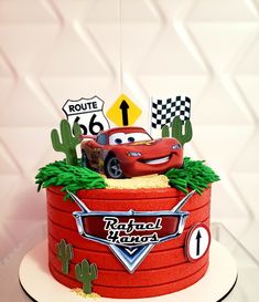 a birthday cake with cars on top