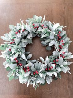 Lambs ear wreath, Christmas wreath, home decor, Christmas decor, holiday decor, holiday wreath, farmhouse wreath, eucalyptus wreath, decor  Add this simple and beautiful Lambs ear, eucalyptus, and red berries wreath to your holiday decor. This wreath is perfect for the holiday season and all winter long. This would be beautiful hung up with red ribbon on the door or even inside your home & kitchen. This wreath can help welcome your guest with a warm inviting.  This exact wreath is made on an 18" natural grapevine wreath and comes available in a 24" natural grapevine wreath.  SHIPPING  *Your wreath will be shipped via USPS and on average processing time is approximately 3-5 business days plus shipping times.  IMPORTANT DETAILS: *Know that your wreath may weather differently based on your lo Eucalyptus Wreath Decor, Wreath Eucalyptus, Lambs Ear Wreath, Wreath Home Decor, Eucalyptus Wreath, Berry Wreath, Wreath Farmhouse, Handmade Boutique, Home Decor Christmas