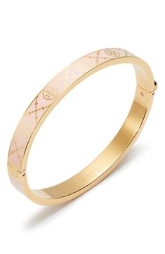 Signature Ts brand a bangle that's softened with inset enamel. 6 1/2" inner circumference; 1/4" width Push-clasp closure Goldtone plate/enamel Imported Tory Burch Jewelry Gold, Tory Burch Set Jewelry, Tory Burch Bangle, Tori Burch, Gift Inspo, Tory Burch Jewelry, Jewelry Inspo, Tory Burch, Gold Jewelry