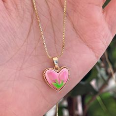 Trendy Pink tulip flower heart shaped pendant charm necklace, 14K real gold plated chain. Crafted from high-quality materials, this stunning necklace features a delicate heart-shaped pendant adorned with a beautiful pink tulip motif, symbolizing love, beauty, and new beginnings. Cute girly aesthetic, y2k layering necklace choker. Exquisite statement necklace to elevate your fashion style. 💎 Features: ♥ Handmade jewelry ♥ Finish Tone: Finest 14K gold plated | Pink ♥ Approximate Measurements: - L Delicate Pink Pendant Flower Necklace, Delicate Pink Flower Pendant Necklace, Pink Clavicle Chain Necklace For Valentine's Day, Pink Delicate Charm Necklace With Delicate Chain, Pink Flower Pendant Necklace With Clavicle Chain, Pink Flower Pendant Clavicle Necklace, Delicate Pink Charm Necklace With Delicate Chain, Dainty Pink Pendant Flower Necklace, Pink Flower-shaped Necklaces For Mother's Day