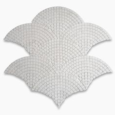 a white tile design with squares on the top and bottom, as well as an oval shape