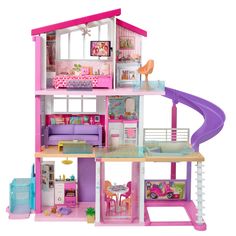 a pink doll house with furniture and accessories