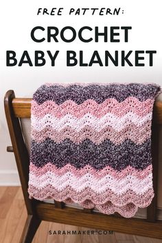 a crochet baby blanket sitting on top of a wooden chair