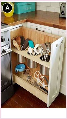 an open cabinet in a kitchen filled with utensils