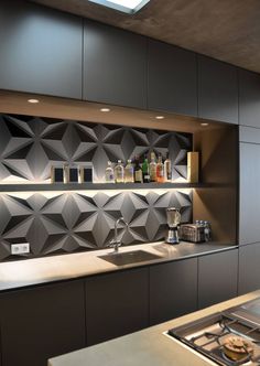 a modern kitchen with stainless steel cabinets and counter tops, along with an arrow pointing to the left