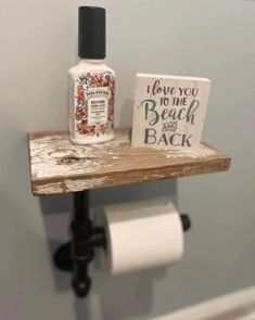 a bathroom shelf with a bottle of hand sanitizer on it and a sign that says have you to the beach and back