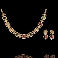 Our Trisha Set embodies the richness of tradition and the allure of modernity! A perfect fusion of elegance and opulence that captivates with its timeless allure of nauratan stones sparkling with their vibrant hues and unparalleled brilliance creating a mesmerizing symphony of color and radiance. The set includes a necklace and a pair of matching earrings. Gold-plated on high-quality brass as the base metal. Made by order. Kindly allow 5-7 weeks for the delivery of this item. For custom or urgen Kemp Necklace, Necklace Traditional, Traditional Necklace, Temple Jewelry, Heritage Jewellery, South Indian Jewelry, Waist Chain, Faux Stone, Head Accessories