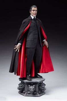 a statue of a man dressed in black and red