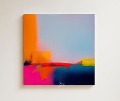 an abstract painting on a white wall with blue, yellow and pink colors in the background