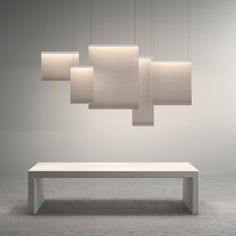 a white table and some lights hanging from it