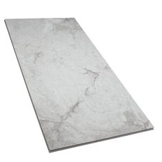 a white marble counter top with grey veining on the edges and an angled edge