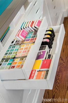 the drawers are filled with different types of cards and papers in each drawer for storage