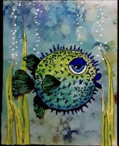 a painting of a fish with blue eyes on it's face and some grass