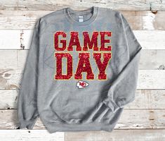 Get ready for every game day with our KC Game Day shirt featuring faux sequins in your favorite team's colors. The oversized print adds a playful touch while showing your support for the Kansas City Chiefs! Chiefs Tshirt Designs, Diy Chiefs Shirts, Chiefs Clothing, Super Bowl Outfit, Kansas City Chiefs Shirts, Chiefs Shirt, Chiefs Shirts, Gray Sweatshirt, Game Day Shirts