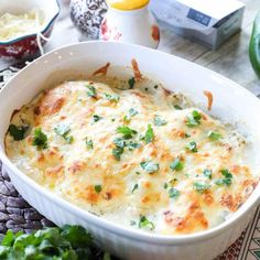 a casserole dish with broccoli on the side