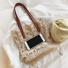 Every gal needs a lightweight, small Summer-vibe handbag! Just a dainty little thing that you can take with you on your minimalist getaway! This handbag will fit all your essentials and pair perfectly with all your stylish vacation or Summer outfits! Crochet Lace Shoulder Tote Bag available in Beige or White Bag Dimensions: 12" H x 5" W x 11" L 2 Straps: 23" each end to end Strap Drop: 9" Magnetic Snap Closure Trendy Beige Canvas Bag, Summer Travel Portable Shoulder Bag, Trendy Vacation Shoulder Bag With Mobile Phone Bag, Trendy Vacation Shoulder Bag With Phone Bag, Chic Portable Shoulder Bag For Vacation, Trendy Beige Shoulder Bag For Everyday, Trendy Beige Shoulder Bag, Trendy Beach Bag With Mobile Phone Pocket For Travel, Trendy Beach Bag With Mobile Phone Bag For Travel