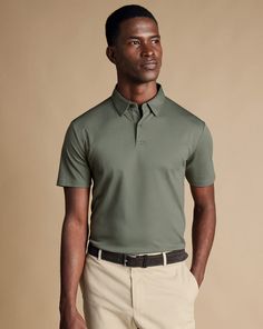 100% cotton, Mercerized yarn for a silky handfeel, Concealed button-down collar, One button placket, Machine washable - Smart Jersey Polo - Sage Green | Men's Charles Tyrwhitt Smart Jersey Polo Shirt - Sage Green Size Large Cotton Sage Green Outfit Men, Earth Tone Outfits Men, Beige Pants Outfit, Polo Shirt Outfit Men, Wedding Motif, Street Wedding, Polo Shirt Outfits, Shirt Outfit Men, Pants Outfit Men