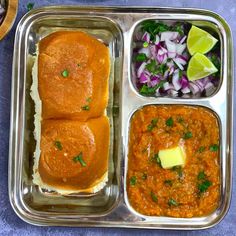 a metal tray filled with different types of food