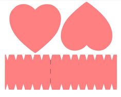 two hearts are cut out from the paper and placed on top of each other to make a monster's teeth