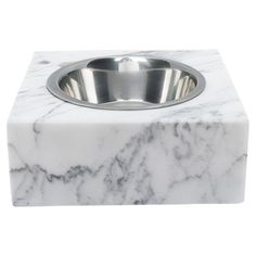 a marble box with a stainless steel bowl on top