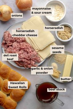 the ingredients to make an appetizer are displayed on a plate with bread, cheese and other items