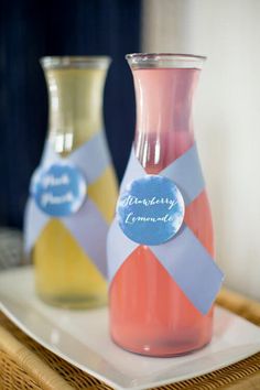 two vases sitting on top of a white plate