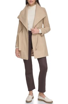 Keep out the cold in this stylish coat framed with a wing collar and defined with a waist tie belt. Wing collar Toggle cuffs Removable tie belt Lined Nickel and camel are 64% polyester, 18% acrylic, 18% rayon; black and white is 51% wool, 45% polyester, 2% nylon, 2% rayon; oatmeal twill is 58% wool, 31% polyester, 6% acrylic, 4% nylon, 1% rayon; black herringbone is 66% polyester, 20% acrylic, 14% rayon Dry clean Imported Model stats: 5'10" height, 32" bust, 25" waist, 36" hip. Model is wearing Fitted Beige Wool Coat For Fall, Fall Outerwear Belted For Cold Weather, Belted Outerwear For Cold Weather In Fall, Fitted Wool Coat For Cold Fall Weather, Fitted Beige Pea Coat For Winter, Fitted Belted Wool Coat For Winter, Fitted Hooded Pea Coat For Winter, Fitted Beige Wool Coat For Spring, Fitted Hooded Pea Coat For Fall