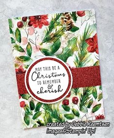 a close up of a christmas card on a white background with red and green flowers