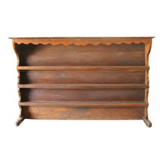 an old wooden shelf with three shelves